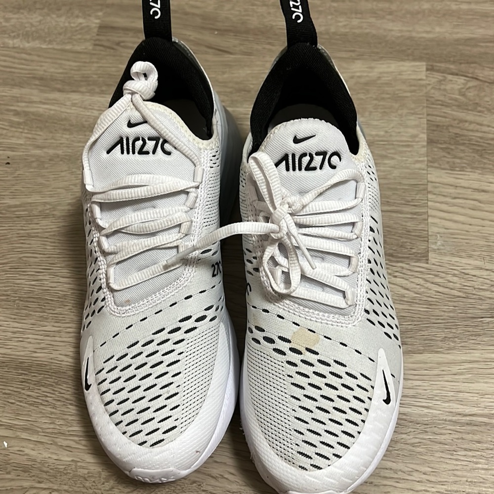 Nike shoes only worn once has a small tea stain which can be easily washed off